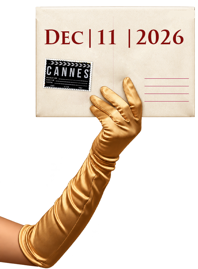 Hand in golden satin glove holding sealed envelope